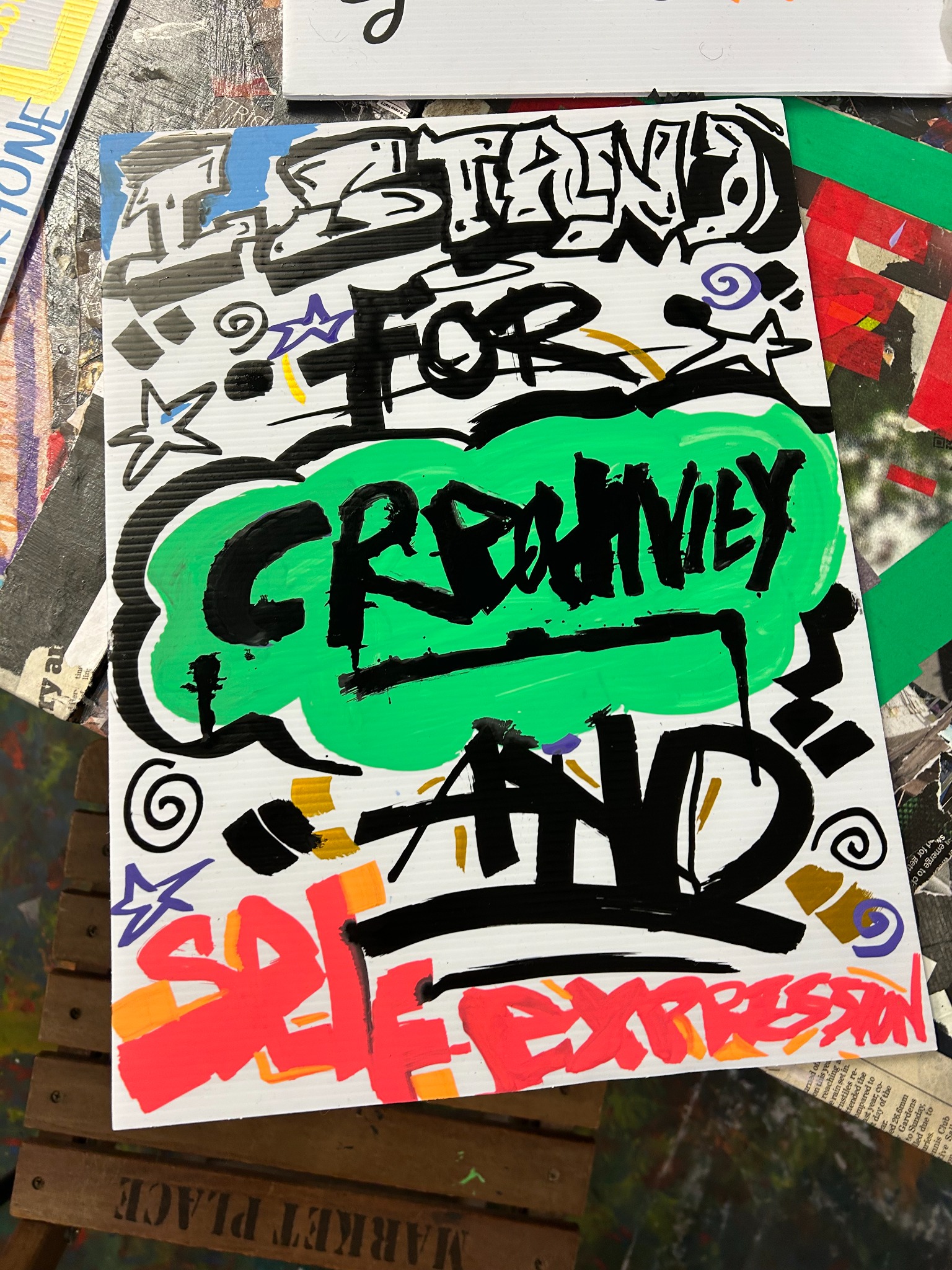 Youth-made placard reading I stand for creativity and self-expression