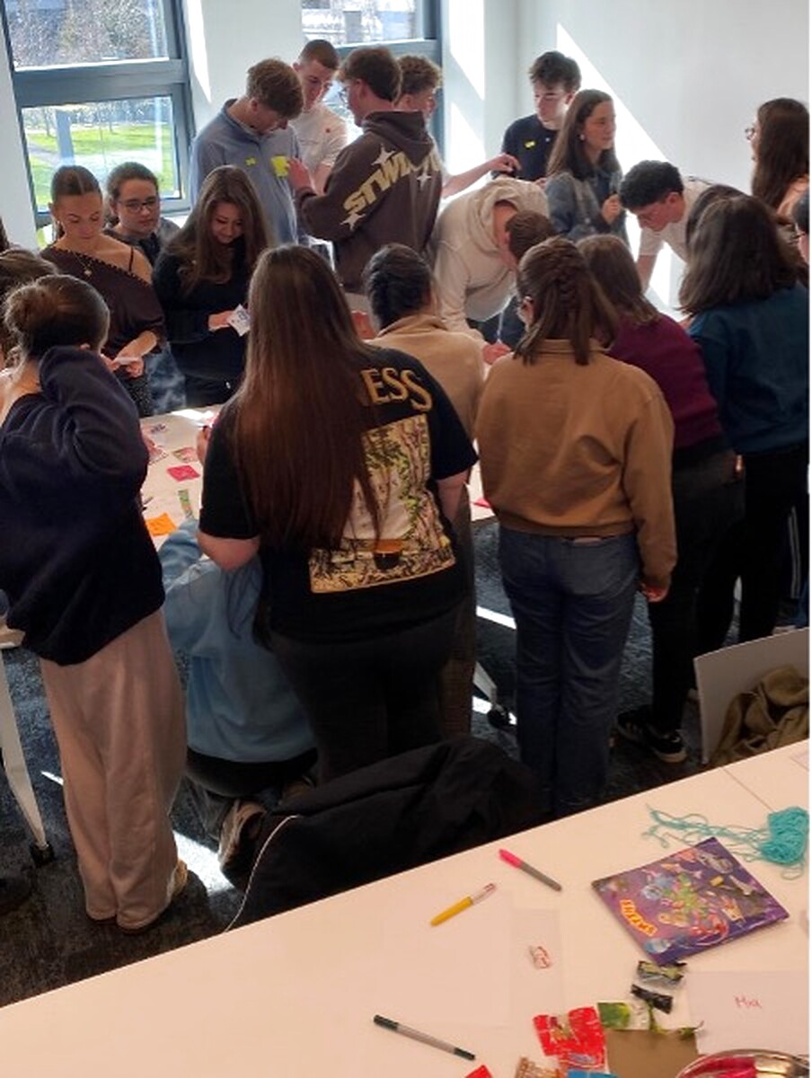 Young people collaborating around a table during a Republic of Ireland participation session